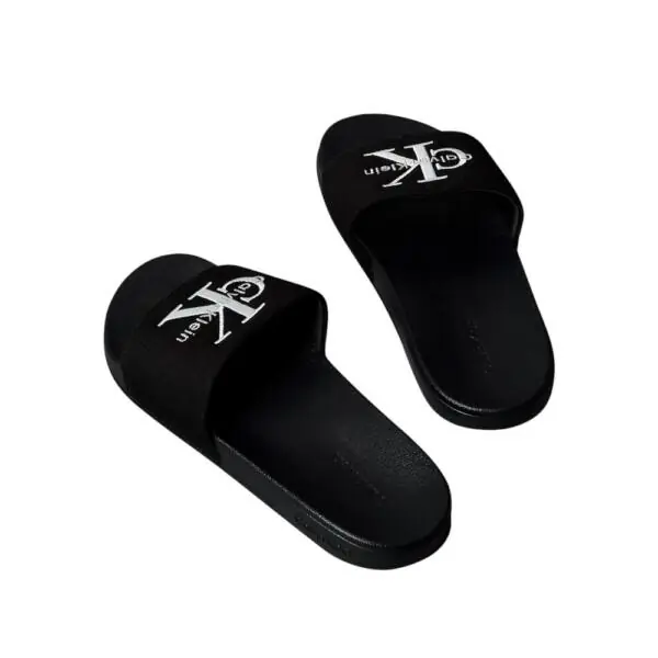 Calvin Klein - Ανδρικές Παντόφλες Slide Canvas Logo YM0YM01393-0GJ Μαύρο YM0YM01393-0GJ