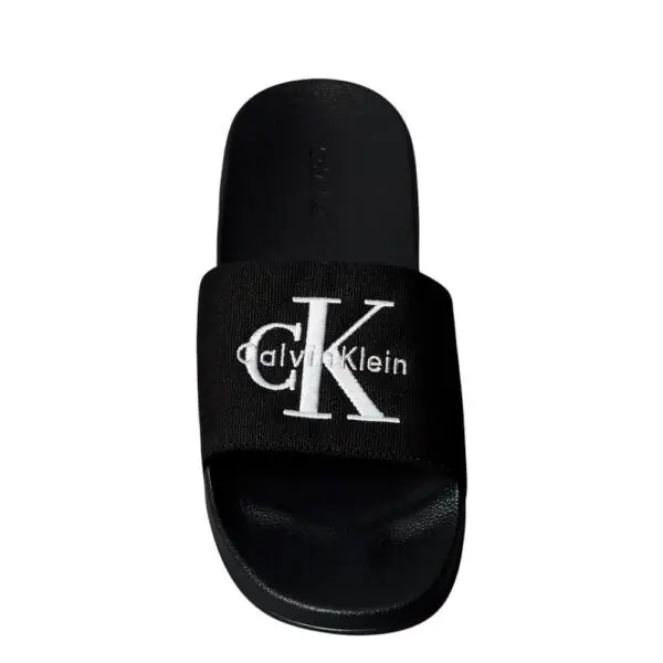 Calvin Klein - Ανδρικές Παντόφλες Slide Canvas Logo YM0YM01393-0GJ Μαύρο YM0YM01393-0GJ
