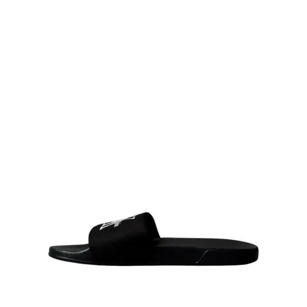 Calvin Klein - Ανδρικές Παντόφλες Slide Canvas Logo YM0YM01393-0GJ Μαύρο YM0YM01393-0GJ