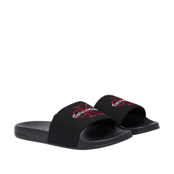Calvin Klein - Ανδρικές Παντόφλες Slide Canvas Logo YM0YM01393-0KQ Μαύρο YM0YM01393-0KQ