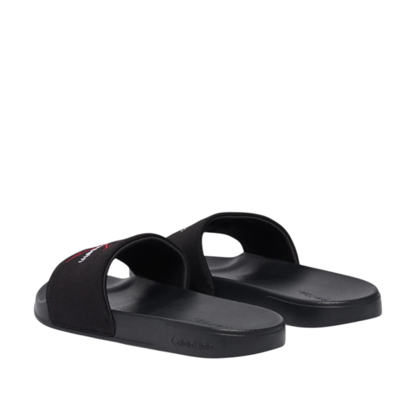 Calvin Klein - Ανδρικές Παντόφλες Slide Canvas Logo YM0YM01393-0KQ Μαύρο YM0YM01393-0KQ
